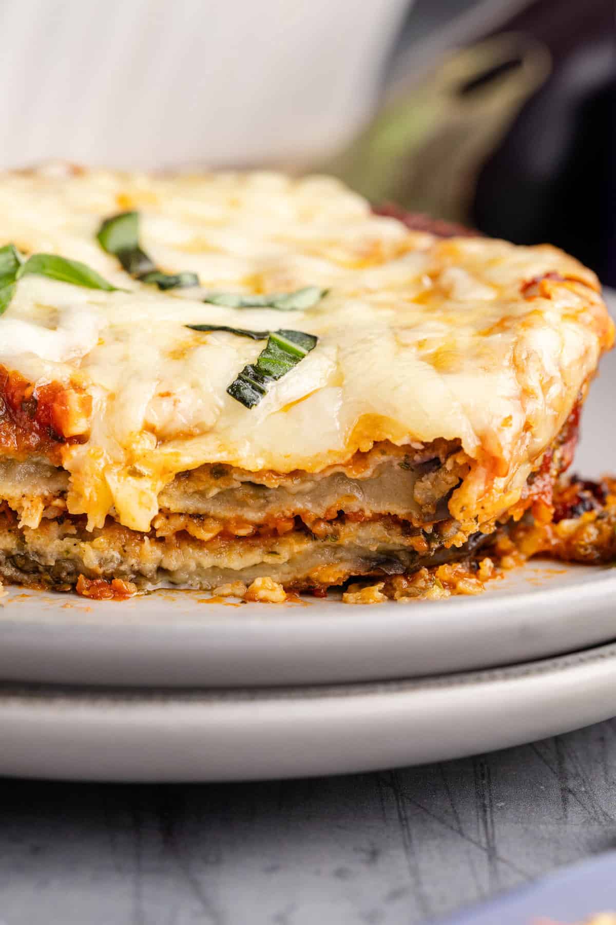 Eggplant Casserole close up on a plate with a piece taken