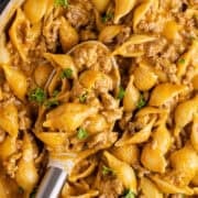 Homemade Hamburger Helper in a skillet up close on a spoon