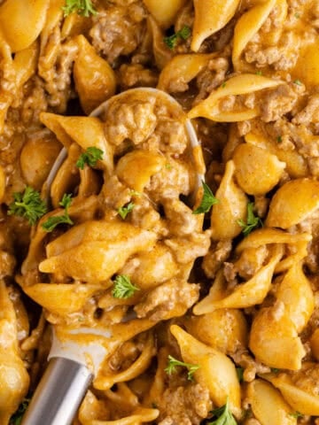 Homemade Hamburger Helper in a skillet up close on a spoon