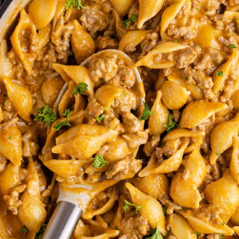 Homemade Hamburger Helper in a skillet up close on a spoon