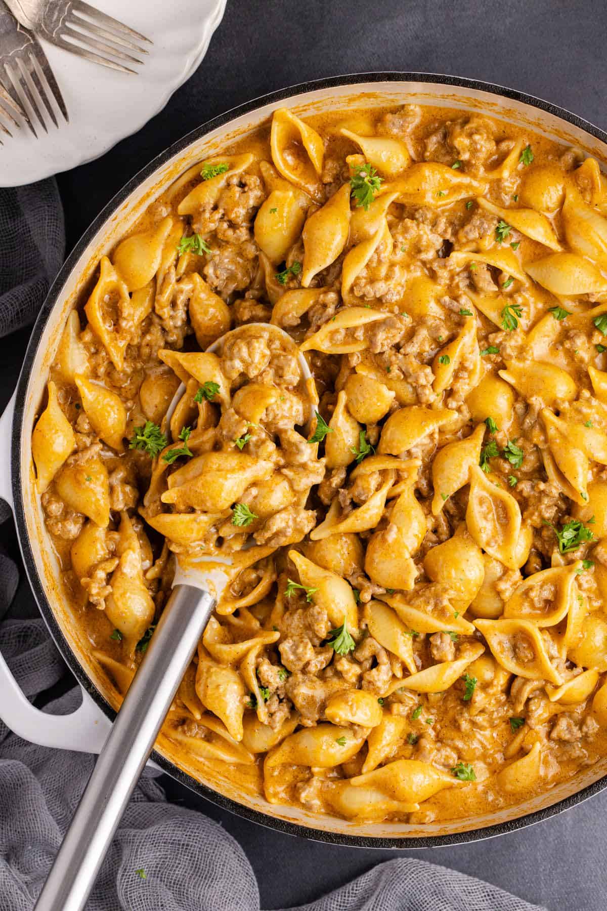 Homemade Hamburger Helper in a skillet with a serving spoon