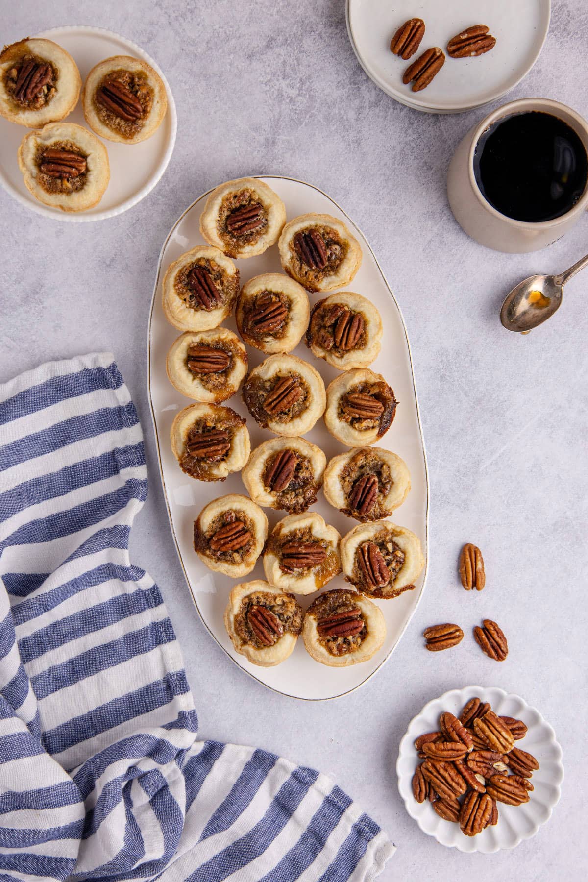 Mini Pecan Pies stacked on a platter from above