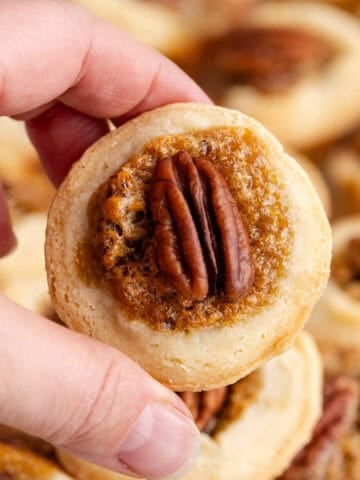 Mini Pecan Pie being picked up, close up