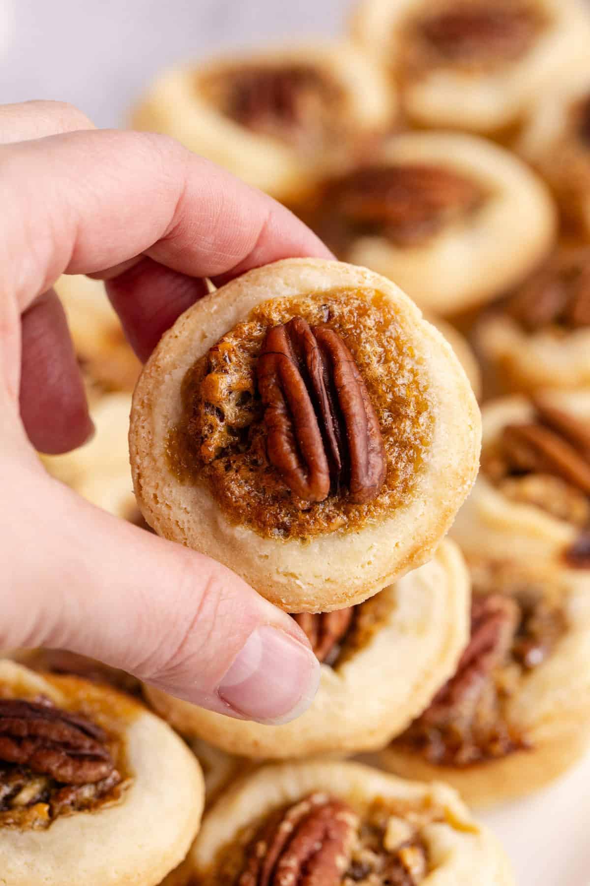 Mini Pecan Pie being picked up