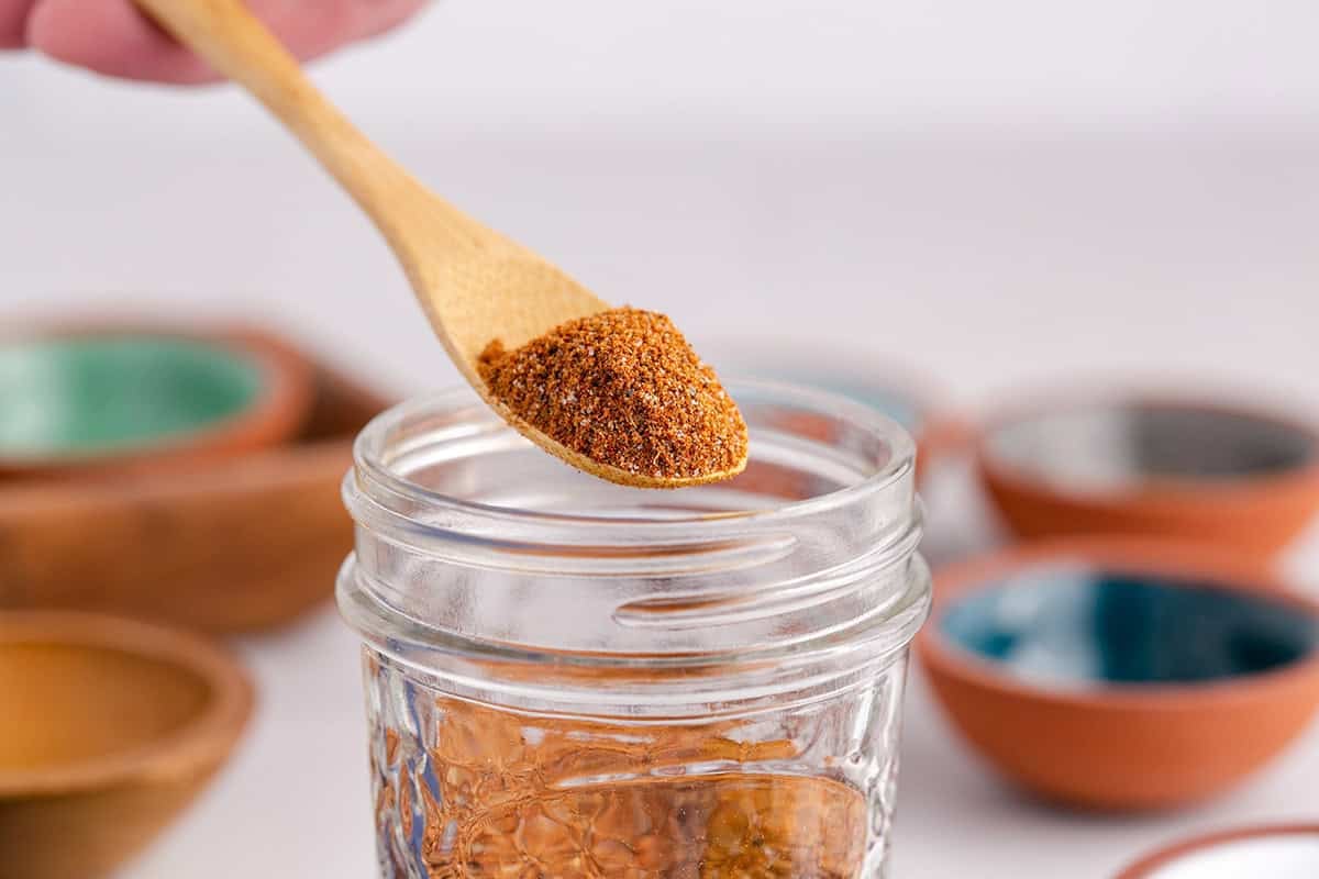 Moroccan Spice Blend with a spoon over the jar