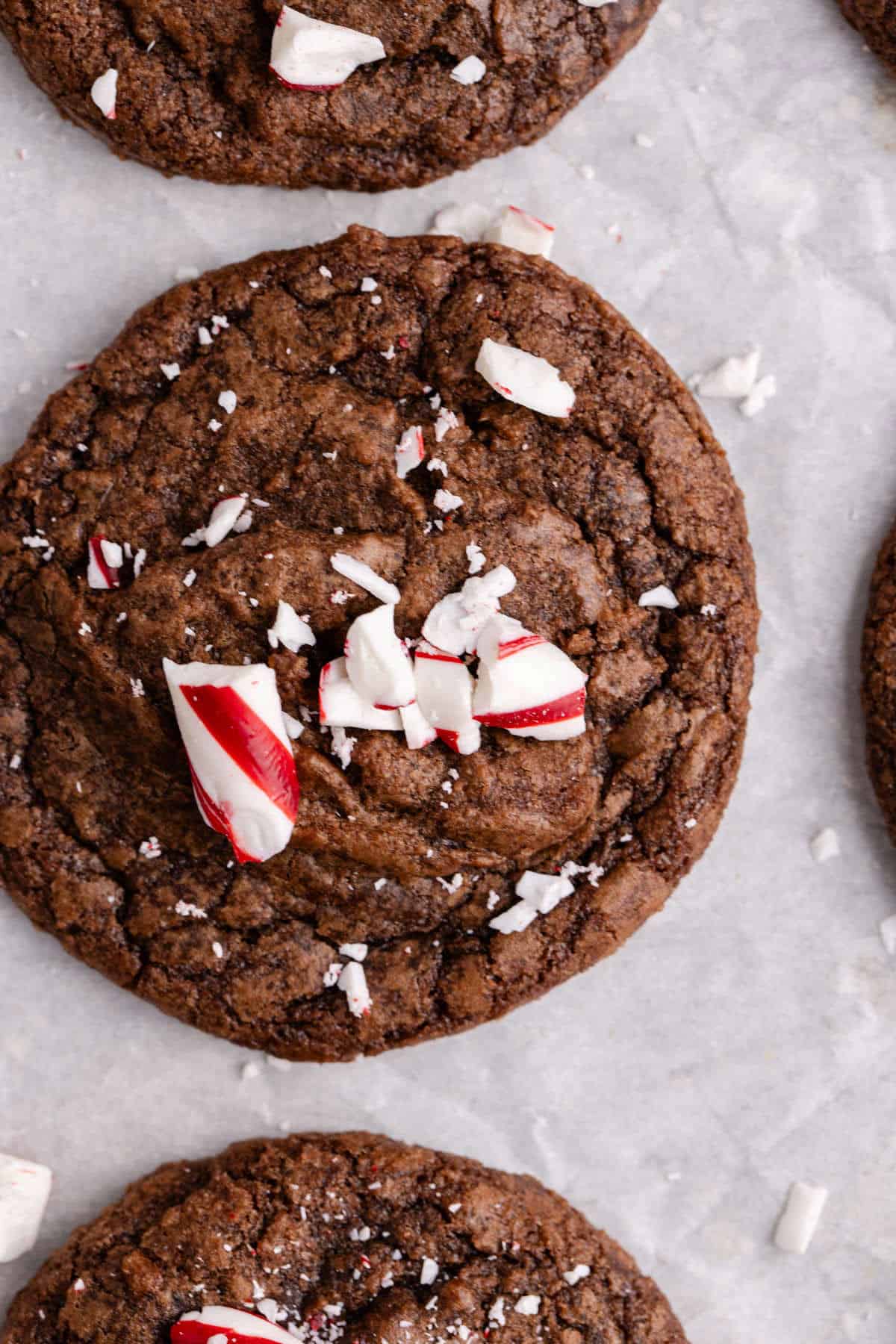 Peppermint Brownie Cookies on parchment paper with crushed peppermint on top from above