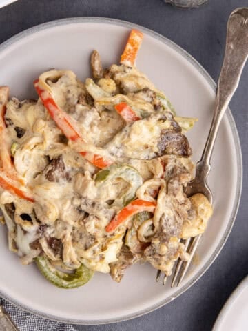 Philly Cheesesteak Casserole on a plate with a fork