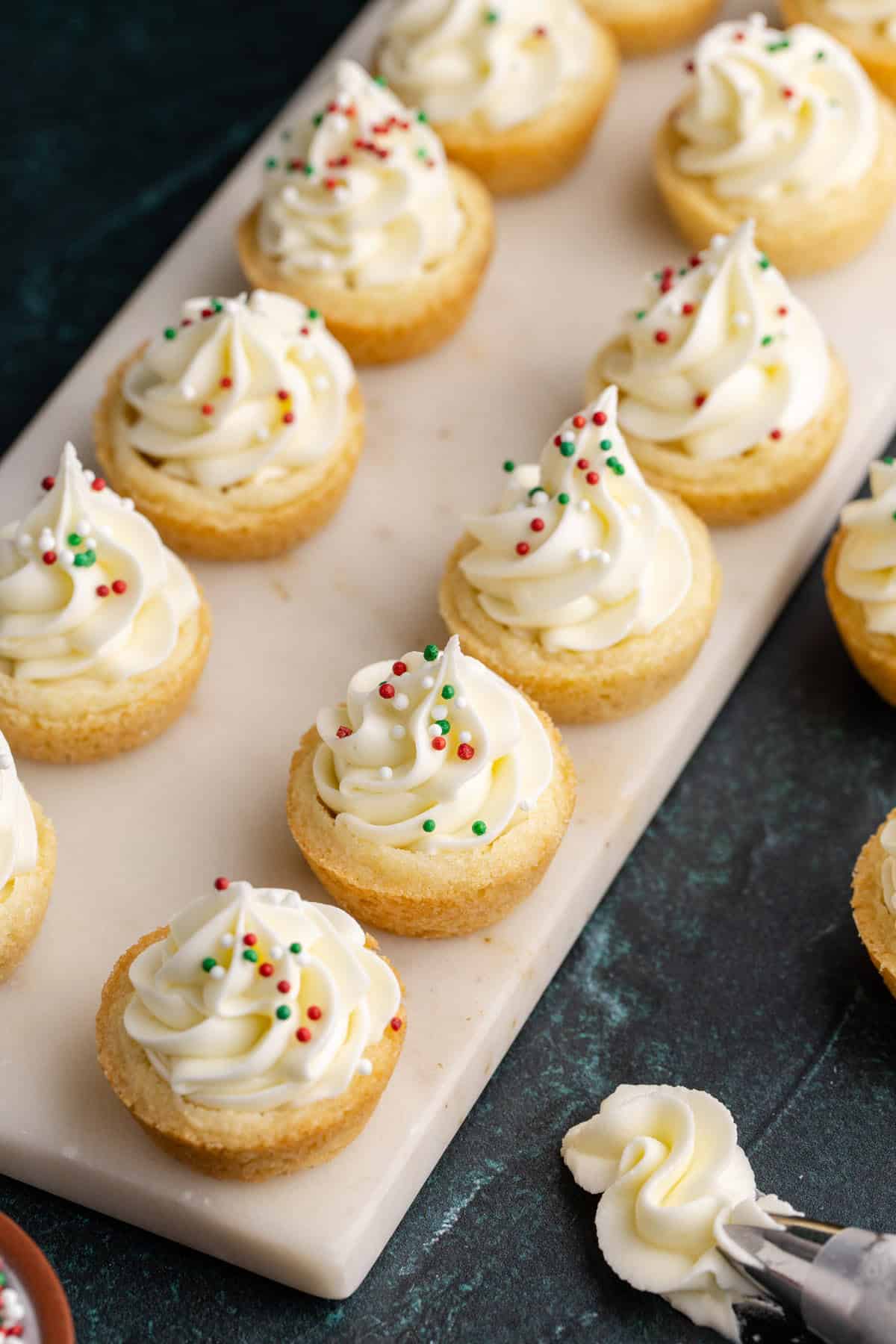 Sugar Cookie Cups with Frosting and Sprinkles on a tray from above