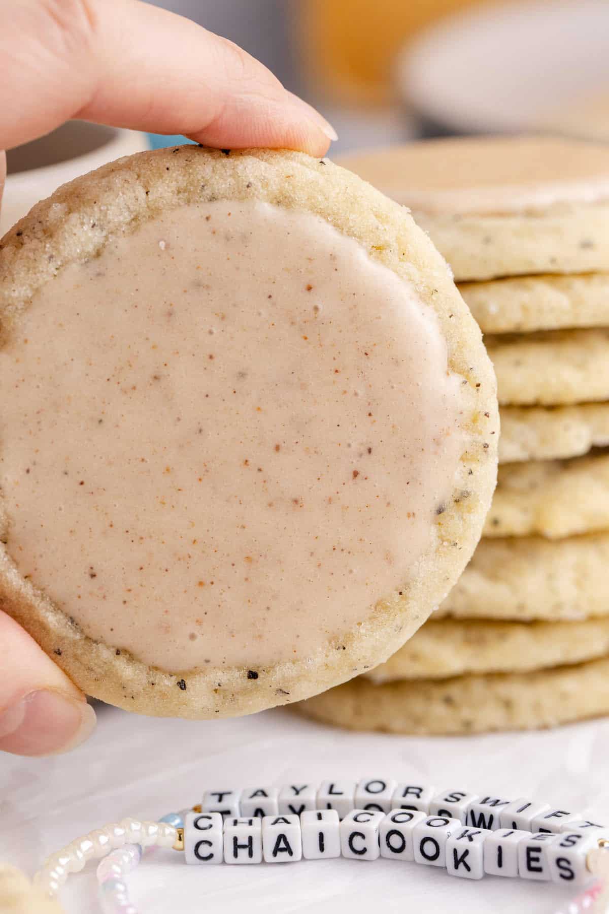 Taylor Swift Chai Cookie up close with a pile in the background