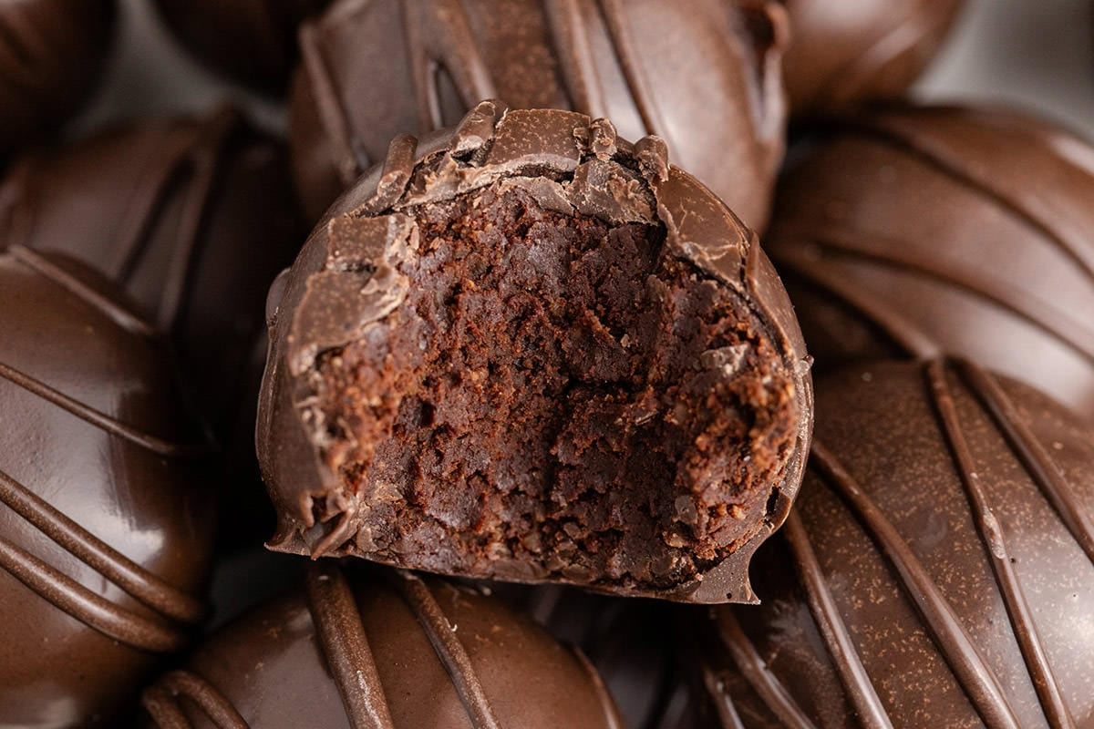 Baileys Truffles stacked with a bite taken from one