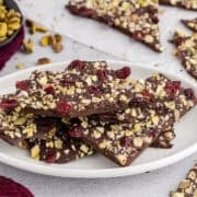 Dark Chocolate Bark with dried cranberries and pistachios on a plate