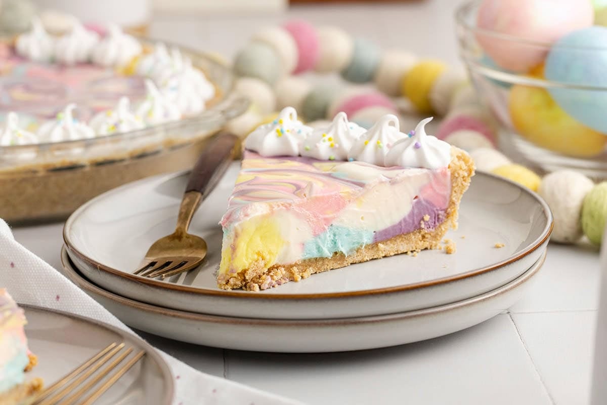 Easter Swirl Cheesecake slice on a plate with a fork beside it