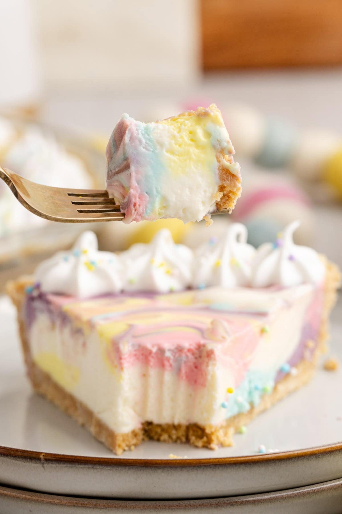 Easter Swirl Cheesecake with a piece on a fork