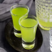 Melon Ball Shots on a tray with cocktail shaker