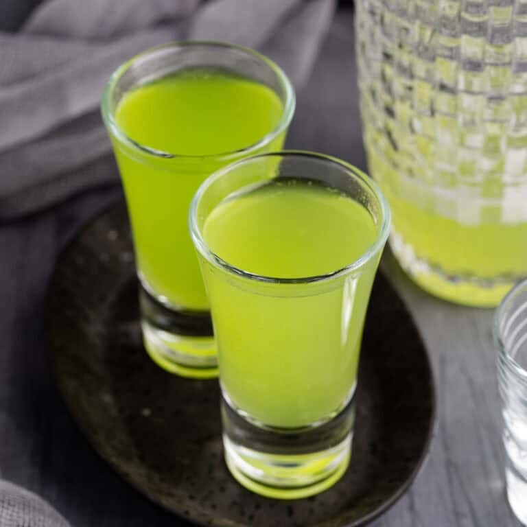 Melon Ball Shots on a tray with cocktail shaker