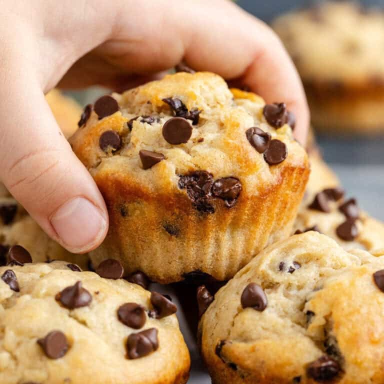 Peanut Butter Banana Muffins with one being taken