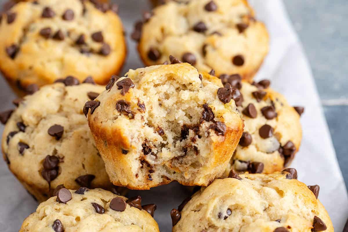 Peanut Butter Banana Muffins stacked with a bite taken