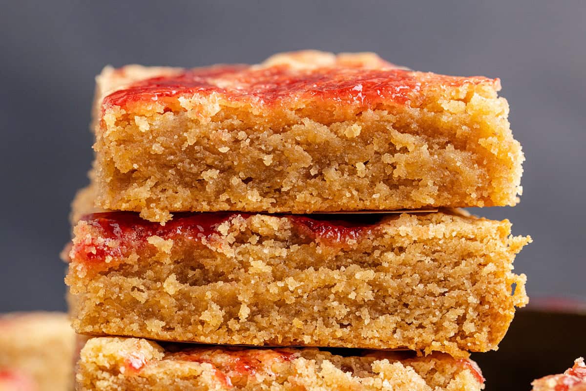 Peanut Butter and Jelly Bars stacked close up to see texture