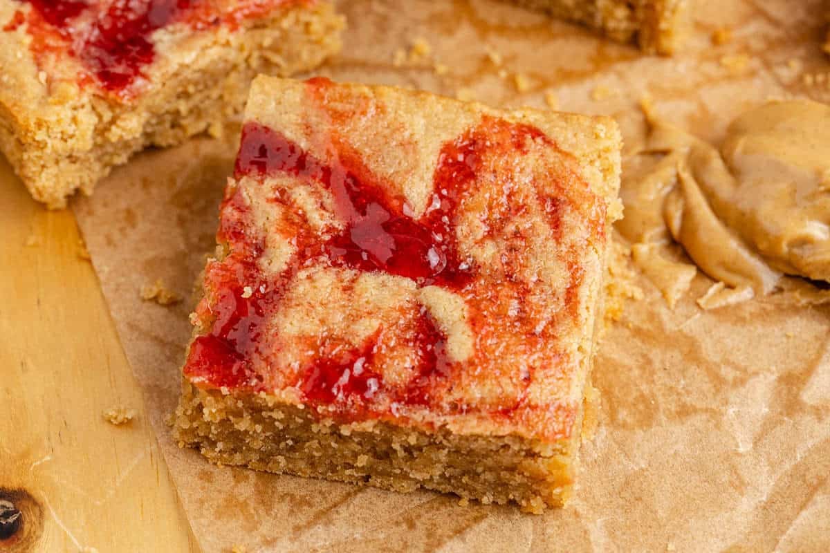 Peanut Butter and Jelly Bars on parchment paper