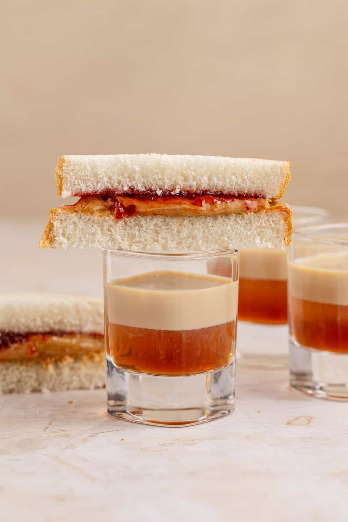 Peanut Butter and Jelly Shot with a small PB and J sandwich on top