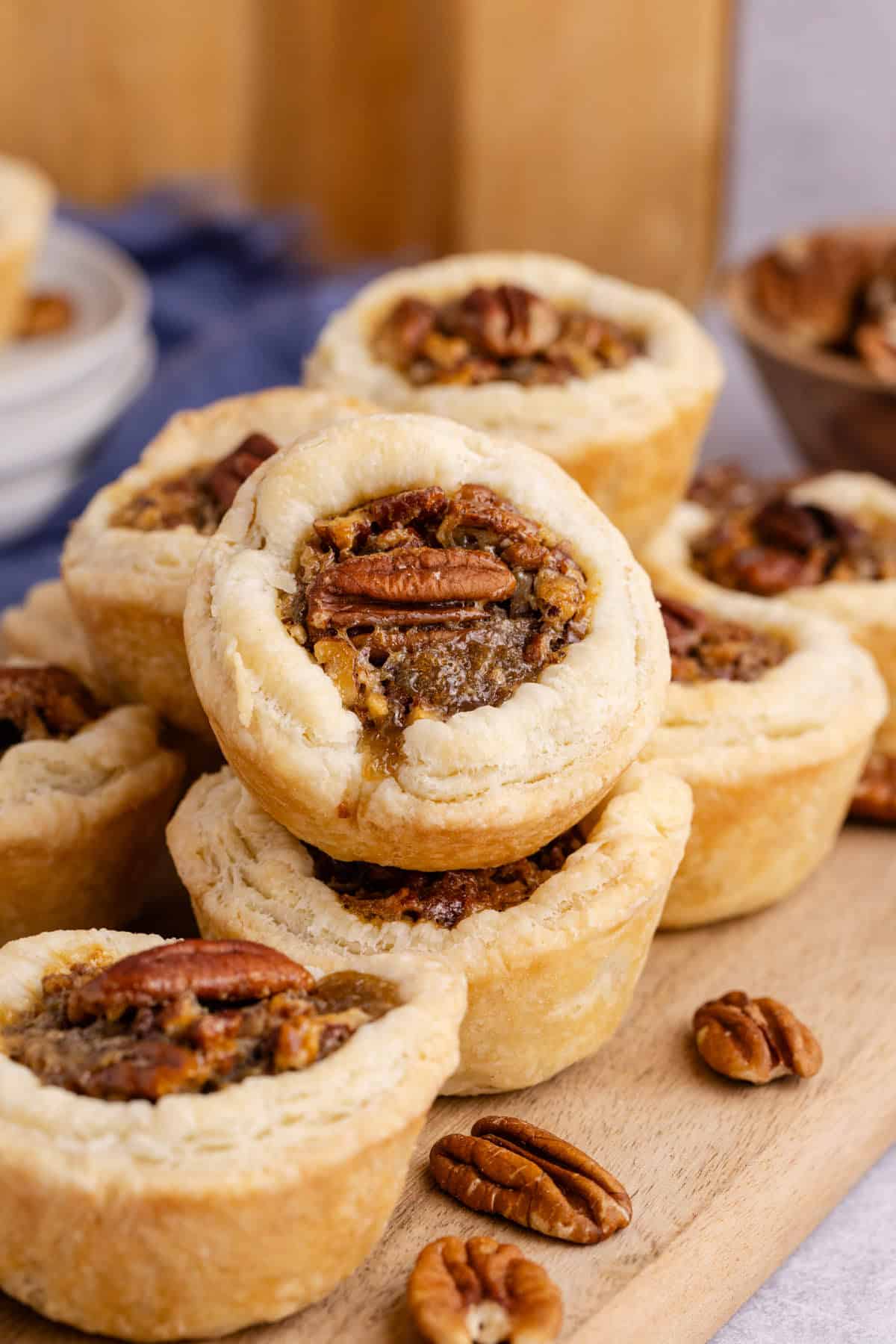 Pecan Tarts stacked together on a cutting board