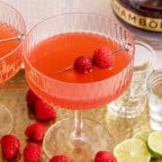 Raspberry Martinis on a tray with raspberry garnish