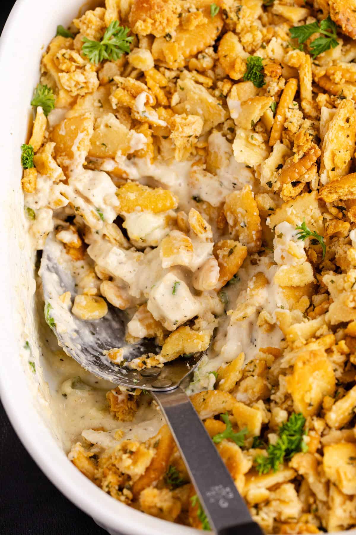 Ritz Cracker Chicken Casserole from above with a serving spoon