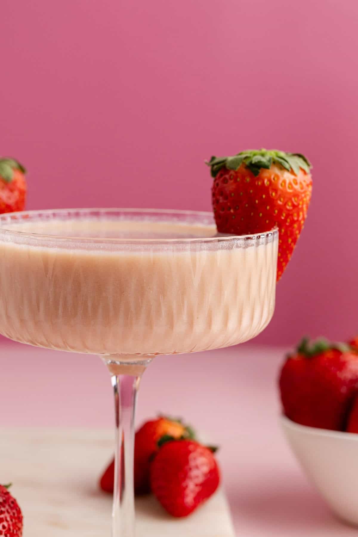Strawberries and Cream Martinis close up with a strawberry garnish
