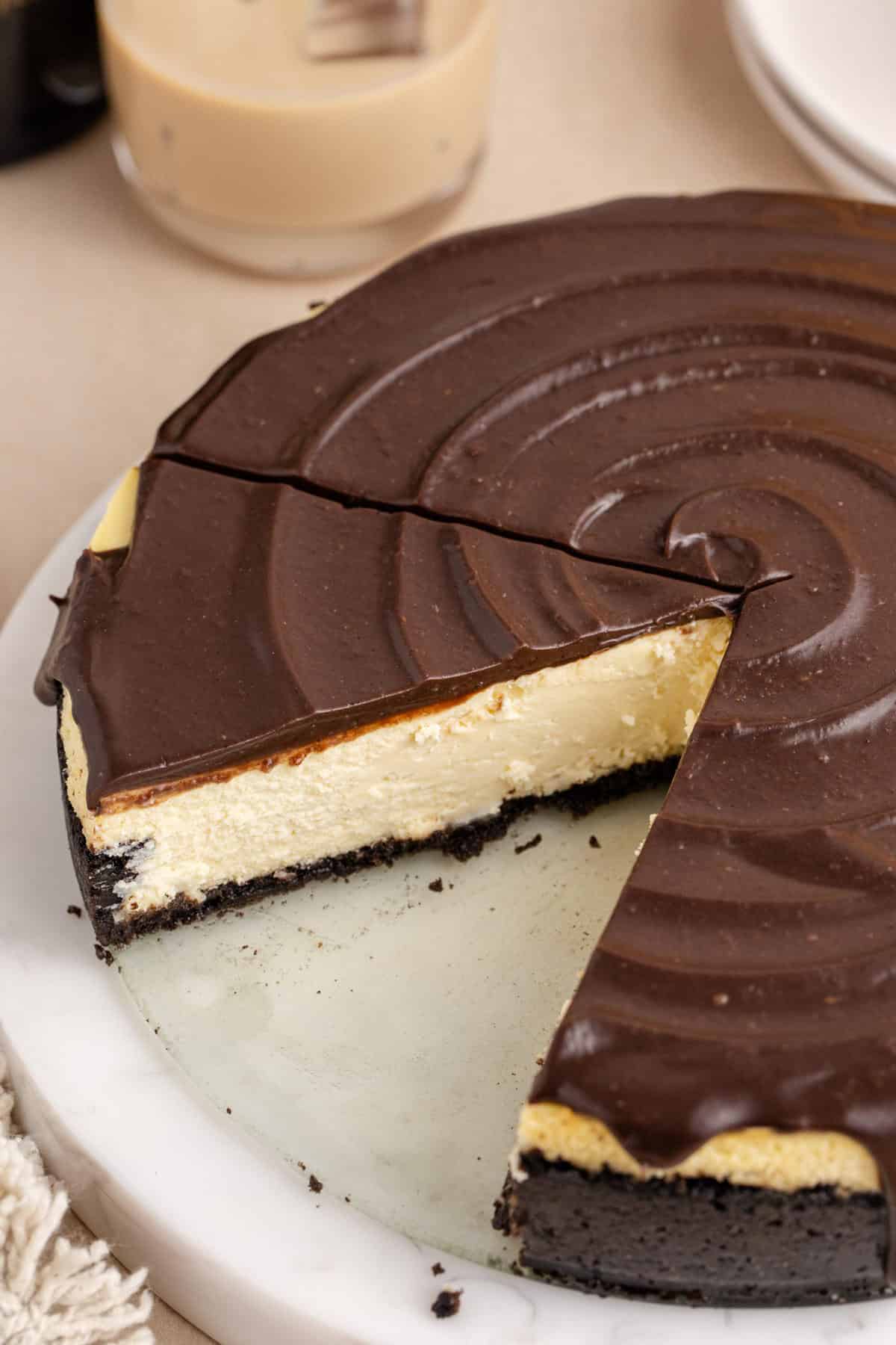 Baileys Cheesecake on a tray with a slice taken