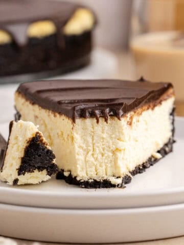 Baileys Cheesecake on a plate with a forkful taken