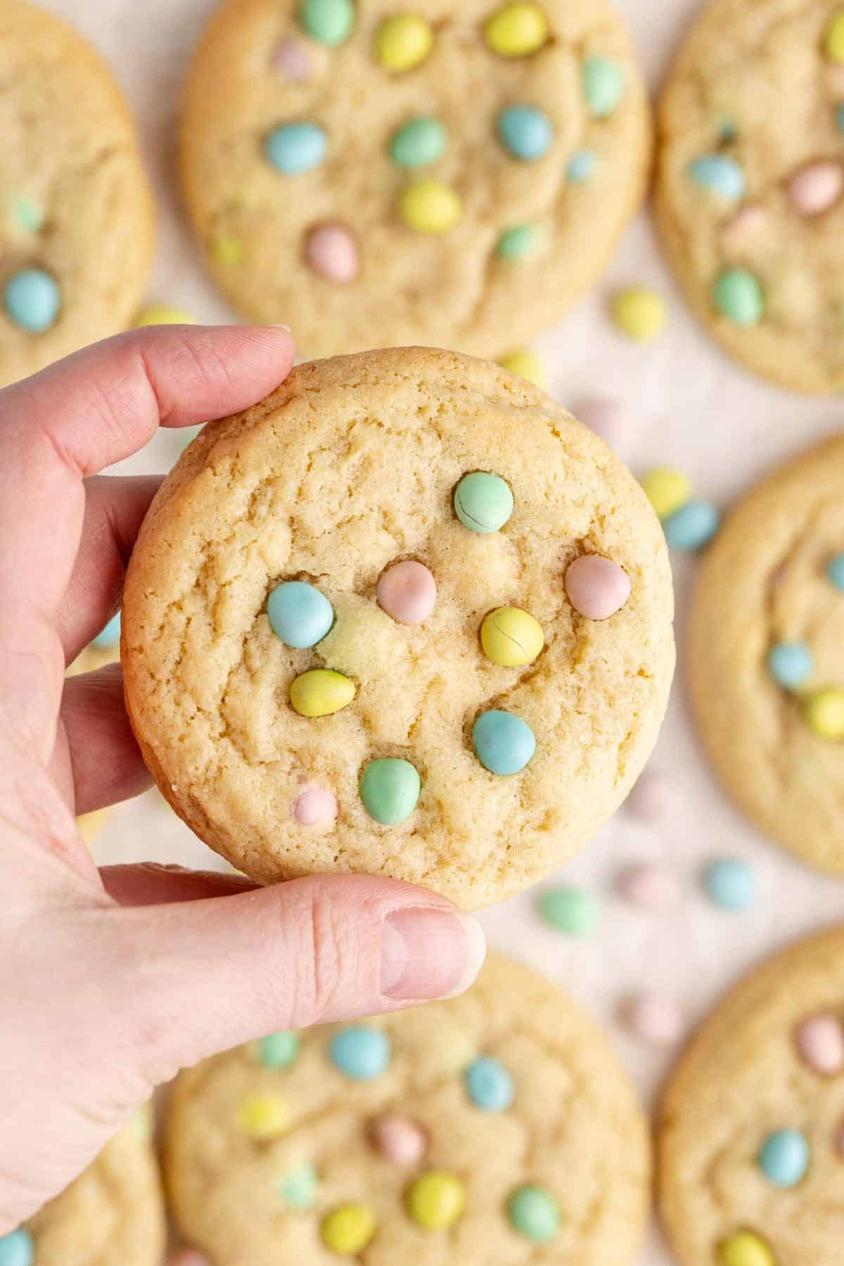 Cadbury Mini Egg Cookie being picked up, up close