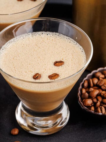 Espresso Martini with Baileys in a Martini Glass on a Tray Garnished with Coffee Beans