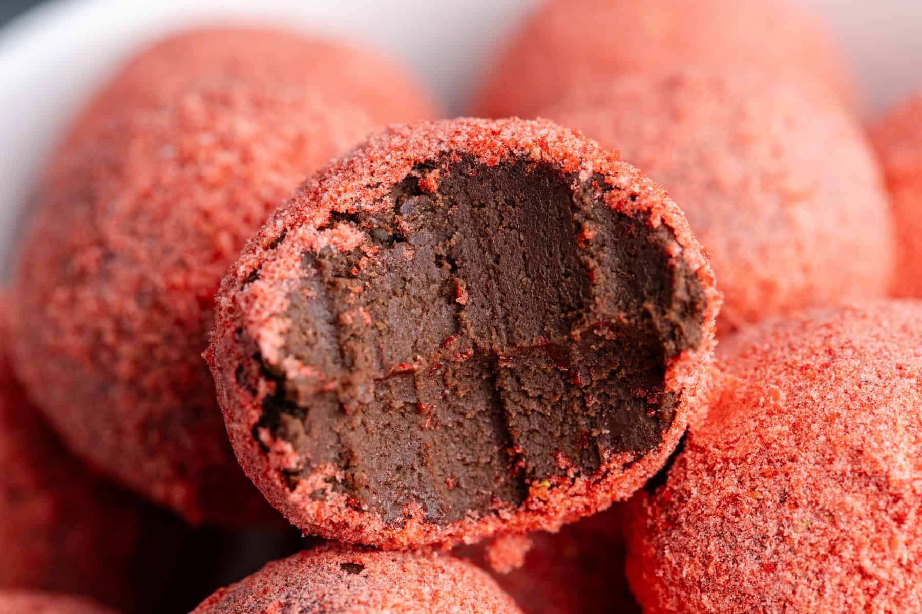 Strawberry Chocolate Truffles up close with a bite taken