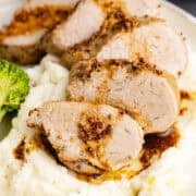 Instant Pot Pork Tenderloin on a bed of mashed potatoes up close