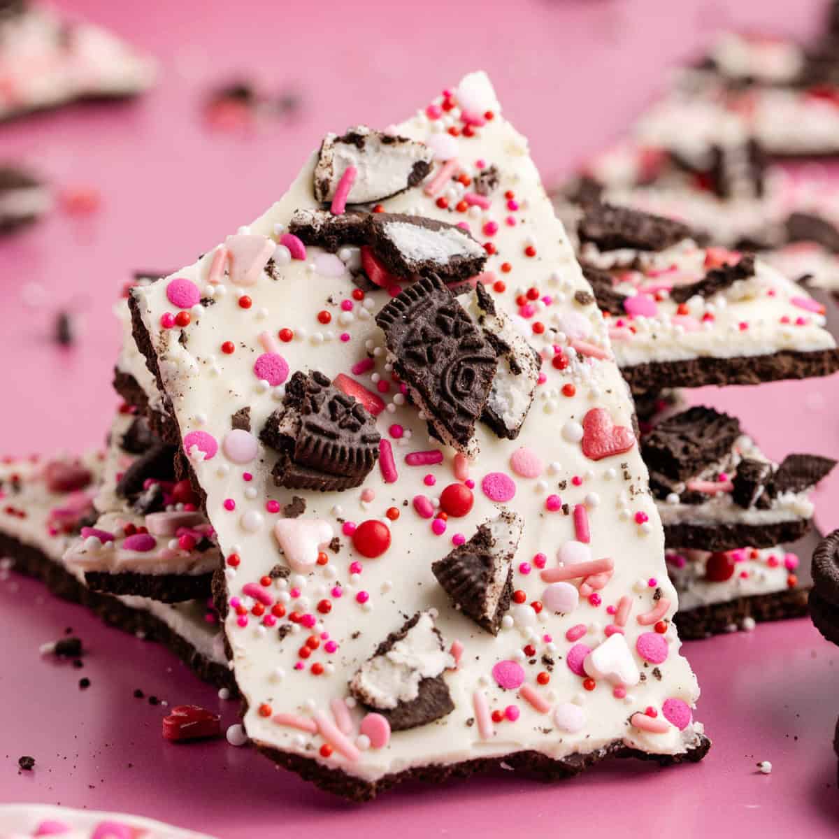white chocolate bark with crushed oreos and red and pink sprinkles