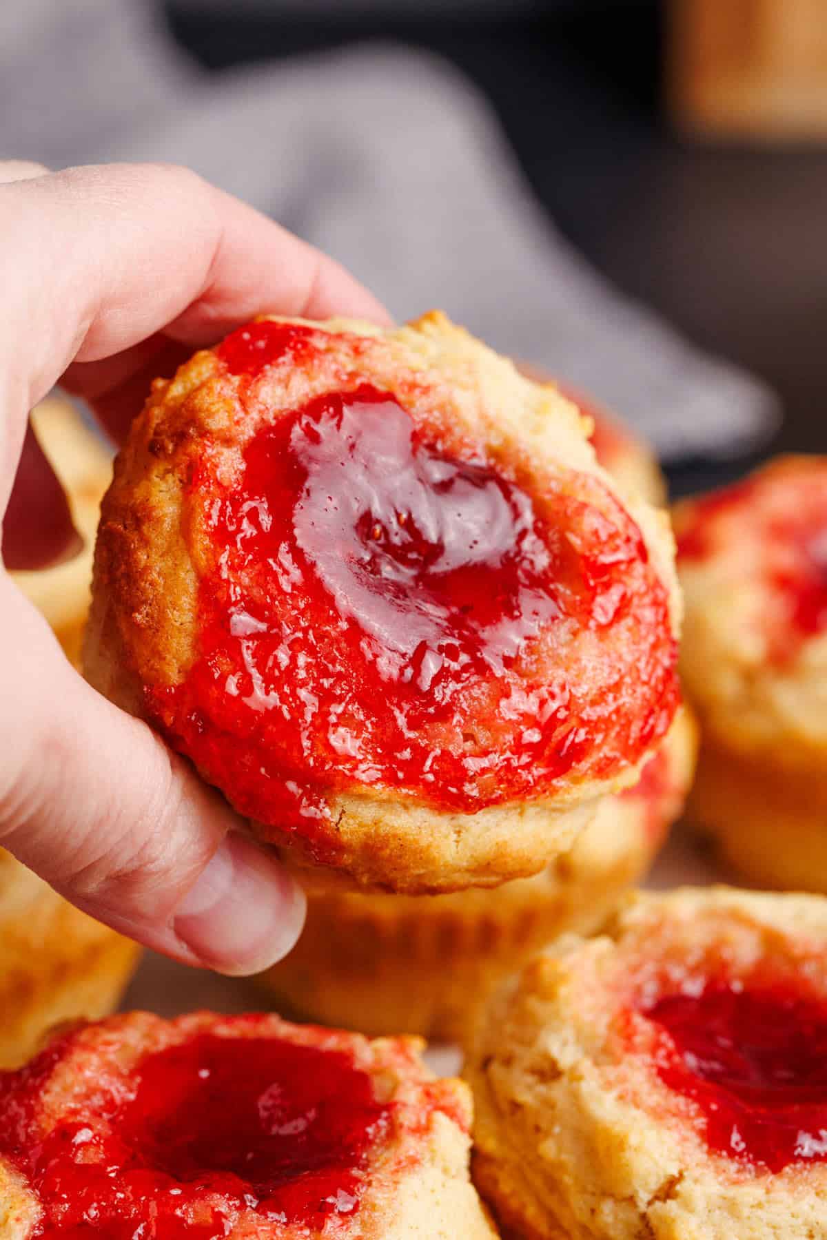 Peanut Butter and Jelly Muffin picked up to show the jammy top layer