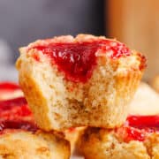 Peanut Butter and Jelly Muffins stacked with a bite taken up close