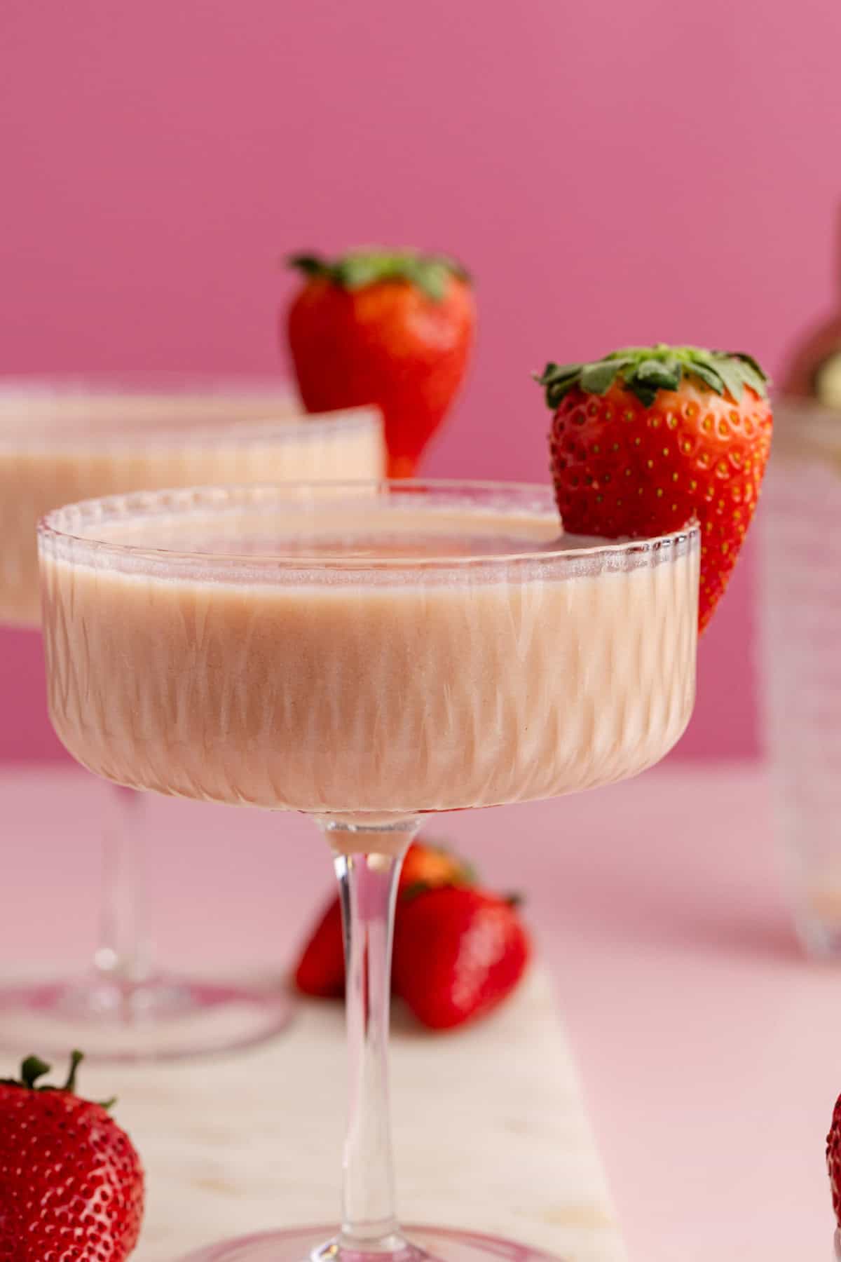 Strawberries and Cream Martini with a berry on the rim
