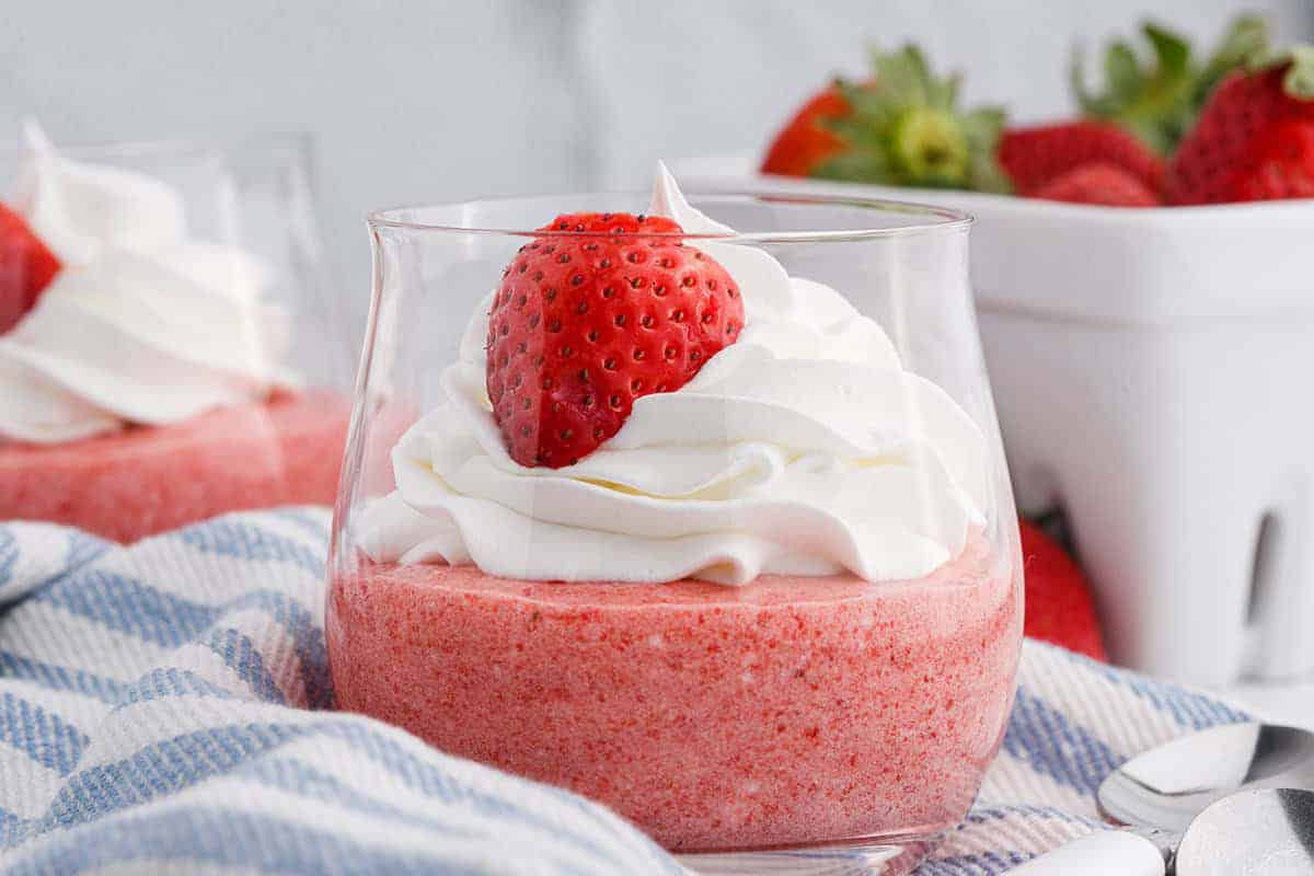 Strawberry Mousse in a glass with whipped cream