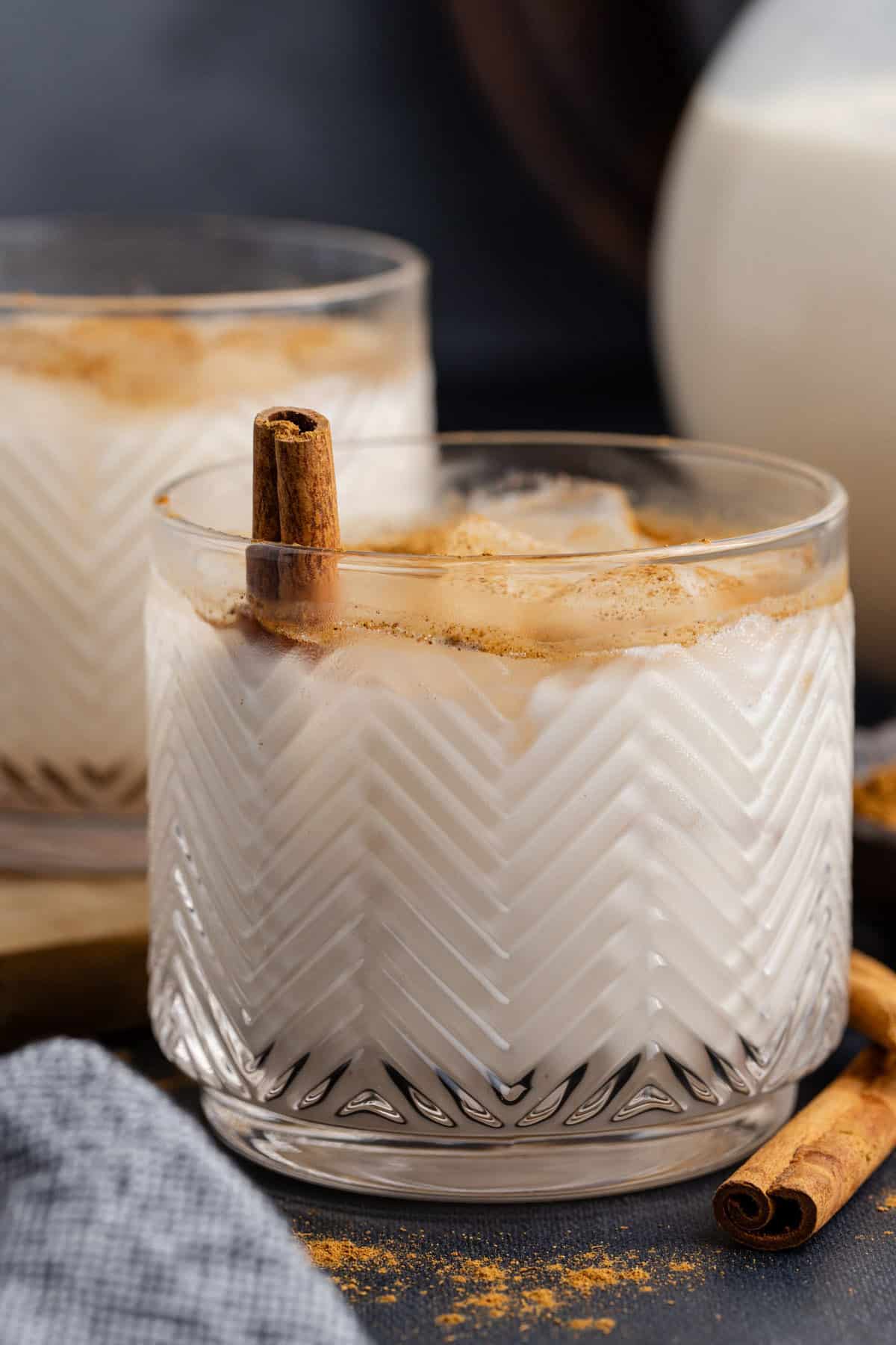 Agua de Horchata garnished with a cinnamon stick
