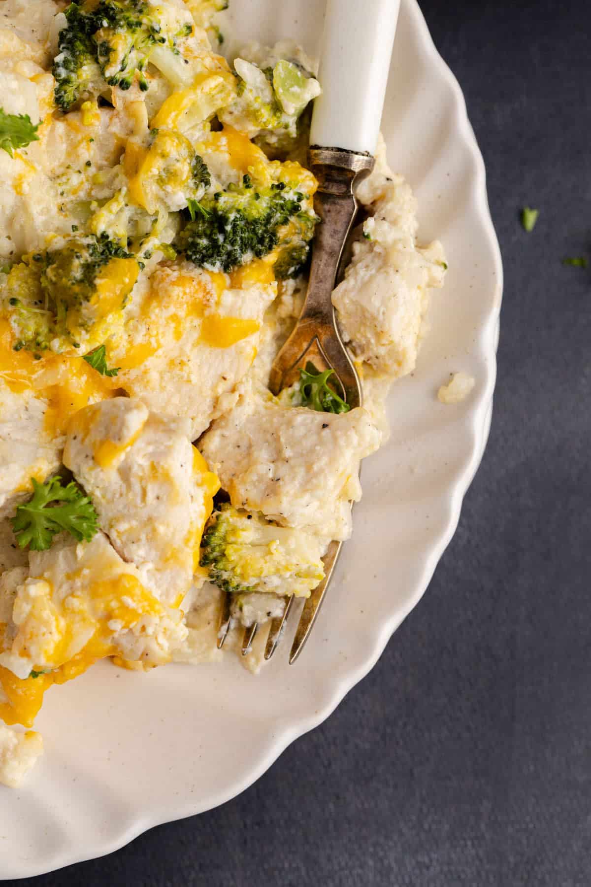 Chicken Broccoli Casserole with Rice close up on a plate with a fork