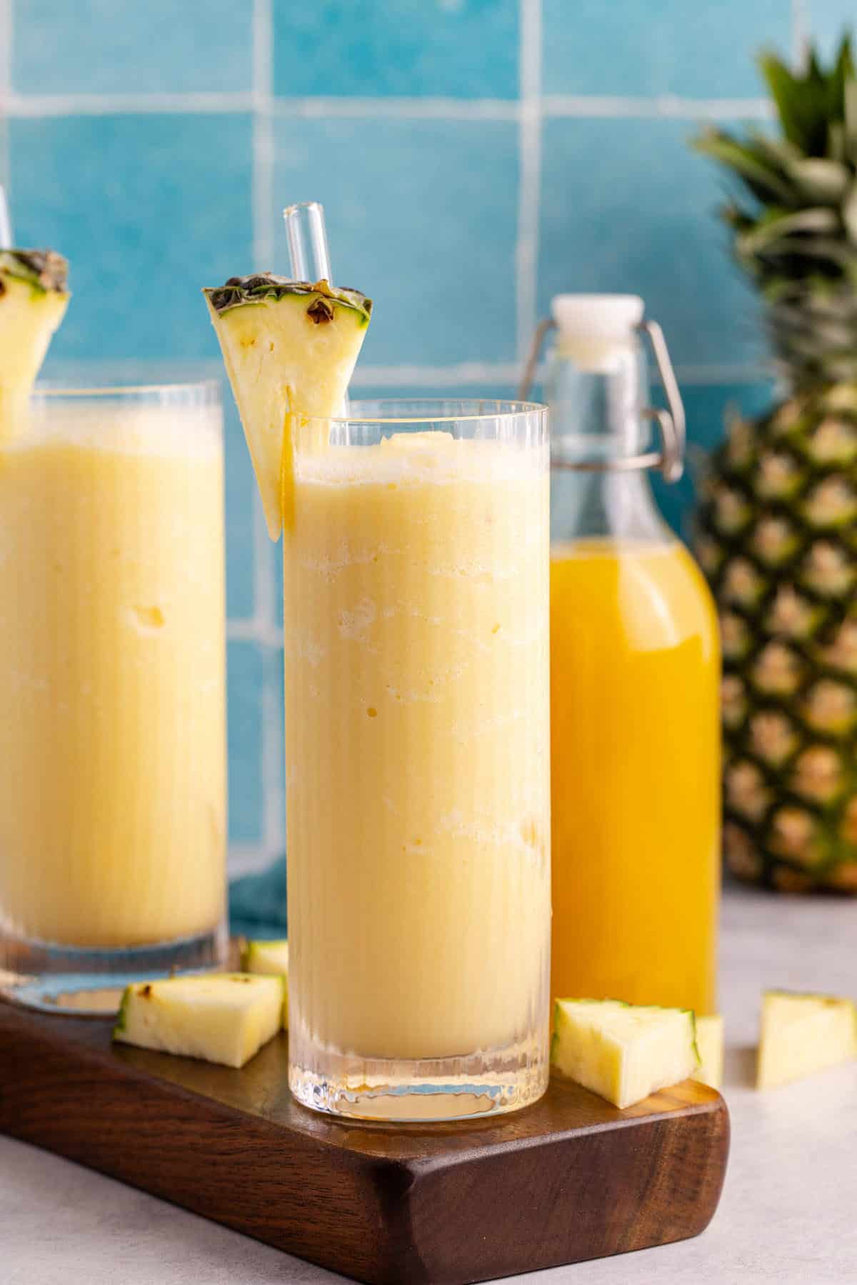 Two glasses of non-alcoholic frozen Pina coladas on a tray