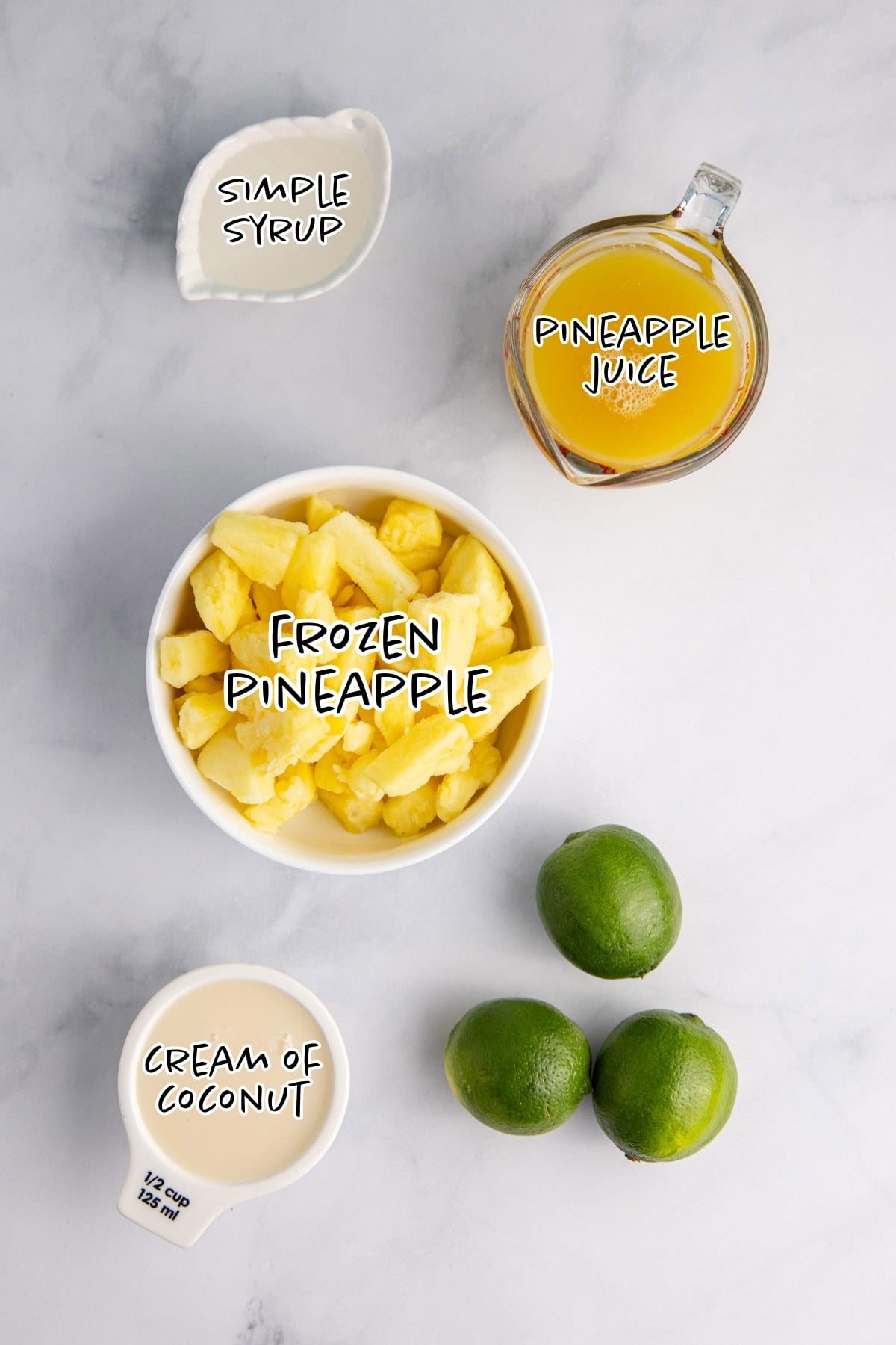Non-Alcoholic Frozen Pineapple Daiquiri ingredients on a counter
