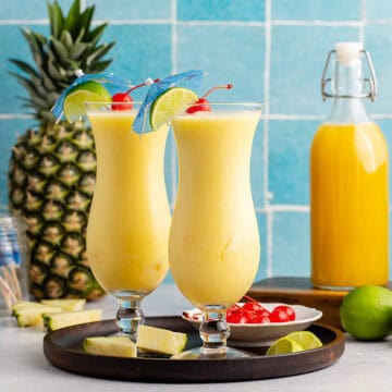 Two Non Alcoholic Frozen Pineapple Daiquiris on a tray