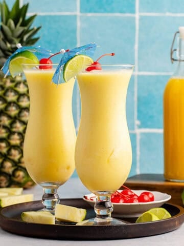 Two Non Alcoholic Frozen Pineapple Daiquiris on a tray