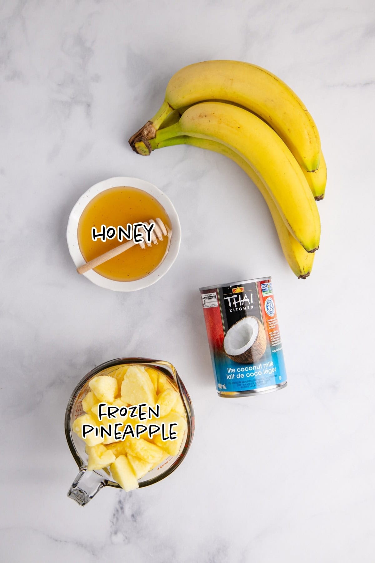 Pineapple Banana Smoothie with Coconut Milk Ingredients on a counter