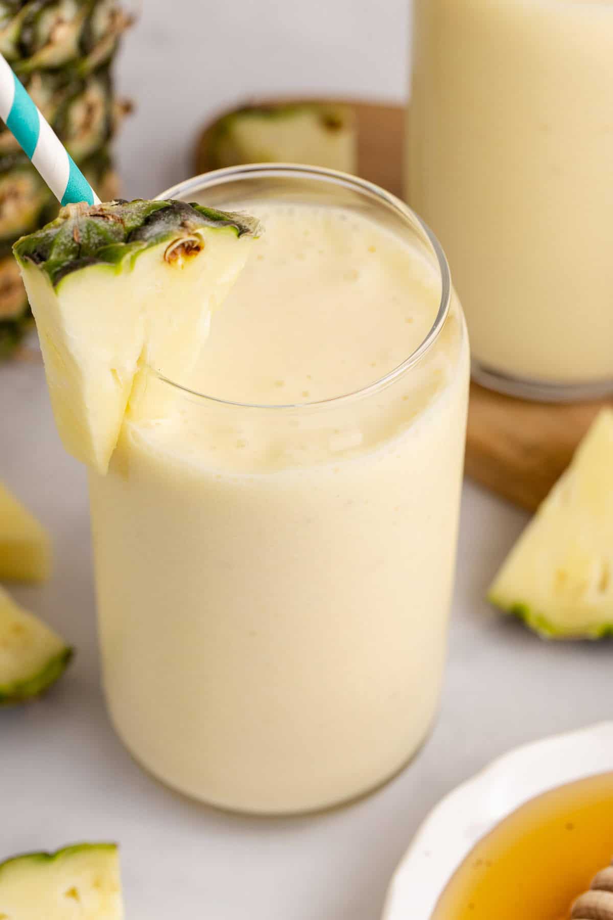 Overhead of a Pineapple Banana Smoothie with Coconut Milk in a glass