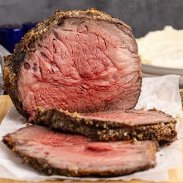 Poor Man's Prime Rib on a cutting board with a few slices in front
