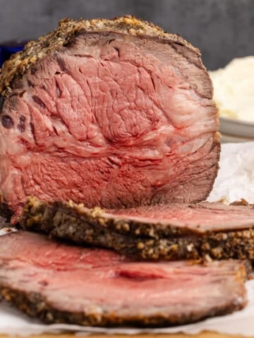 Poor Man's Prime Rib on a cutting board with a few slices in front