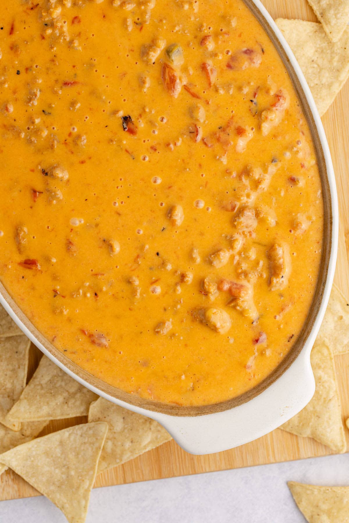 Spicy Sausage Queso in an oval dish from above up close